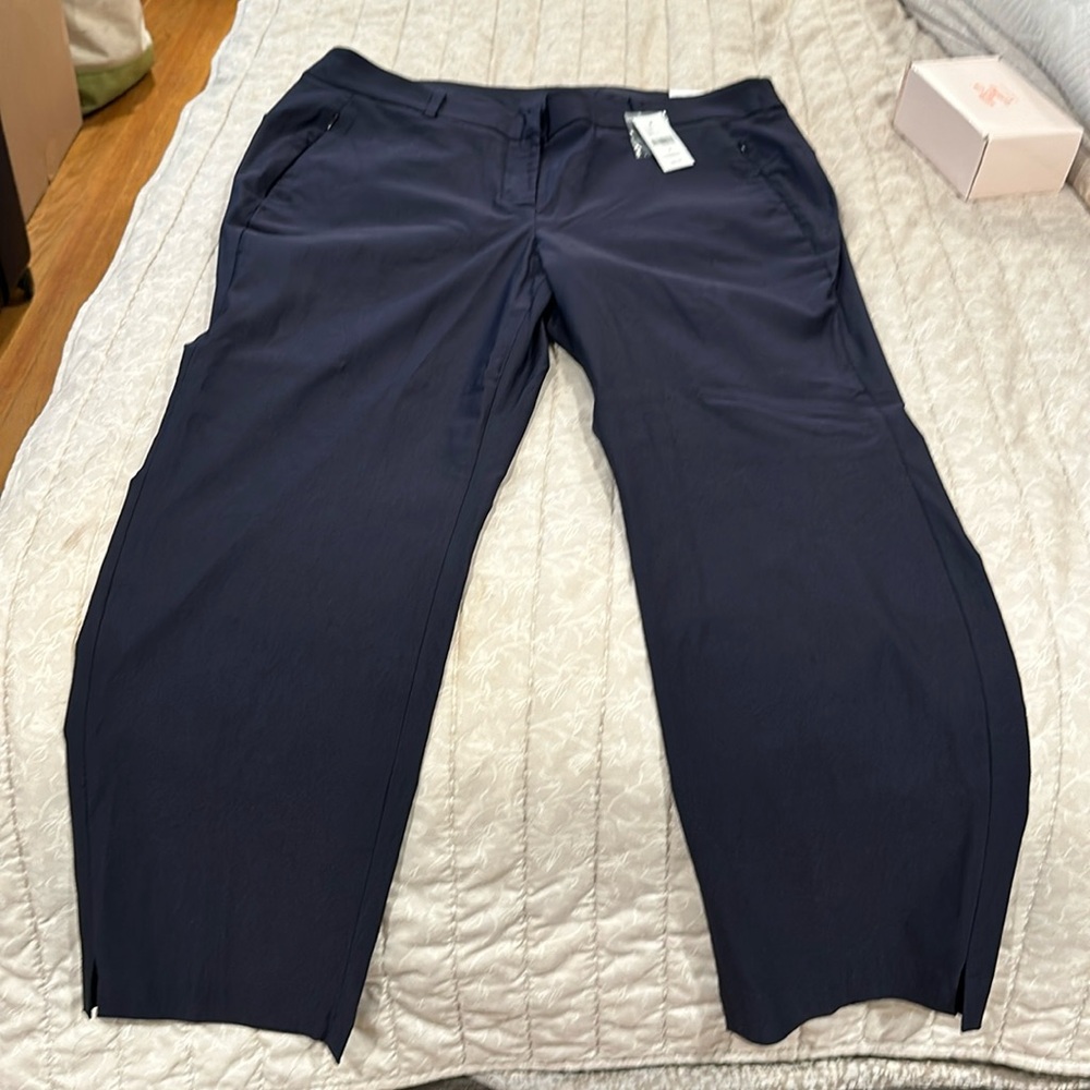 Navy trousers.  Zip front. Zip pockets.